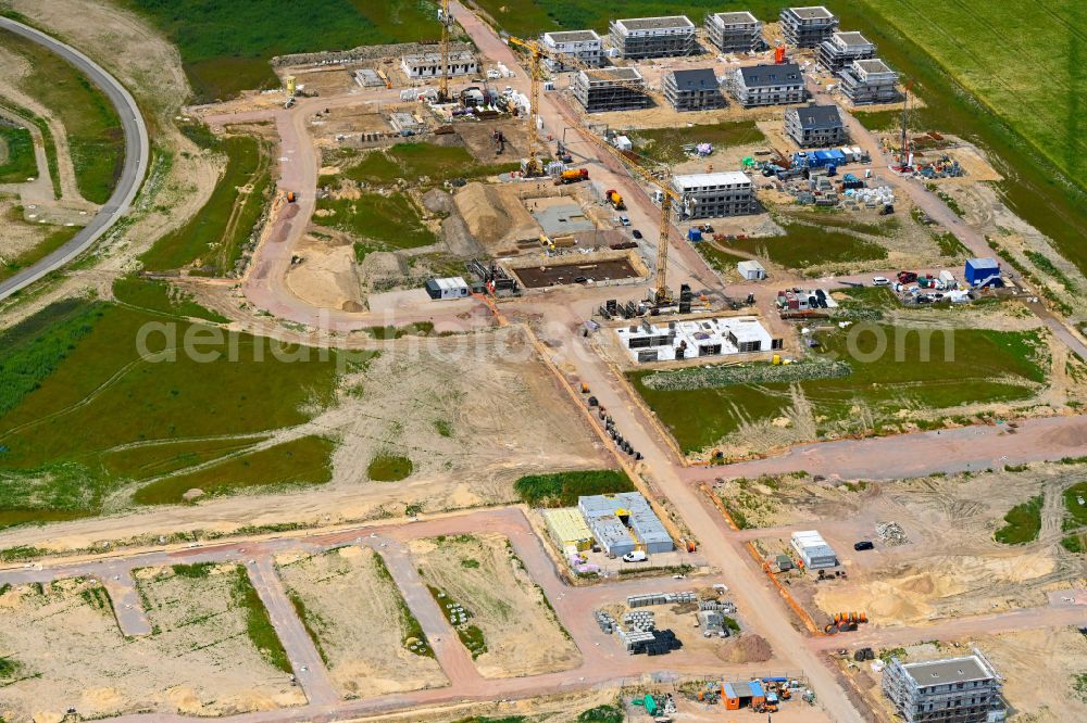 Aerial photograph Wolfsburg - Residential area construction site of a mixed development with multi-family houses and single-family houses- New building at the along the Landstrasse - L322 in Wolfsburg in the state Lower Saxony, Germany