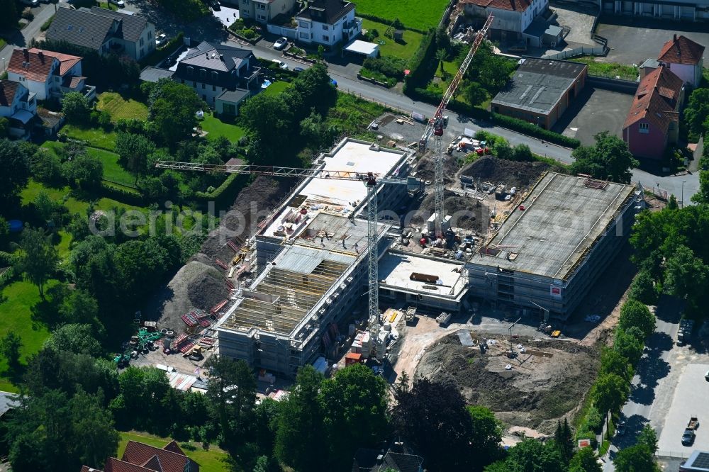 Bad Driburg from the bird's eye view: Construction site of the new buildings of the retirement home - retirement on Hufelandstrasse - Brakeler Strasse in Bad Driburg in the state North Rhine-Westphalia, Germany