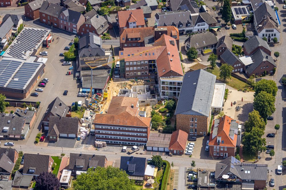 Aerial photograph Hamminkeln - Construction site of the new buildings at the retirement home - retirement St.-Josef-Haus on street Marienvreder Strasse in the district Dingden in Hamminkeln in the state North Rhine-Westphalia, Germany