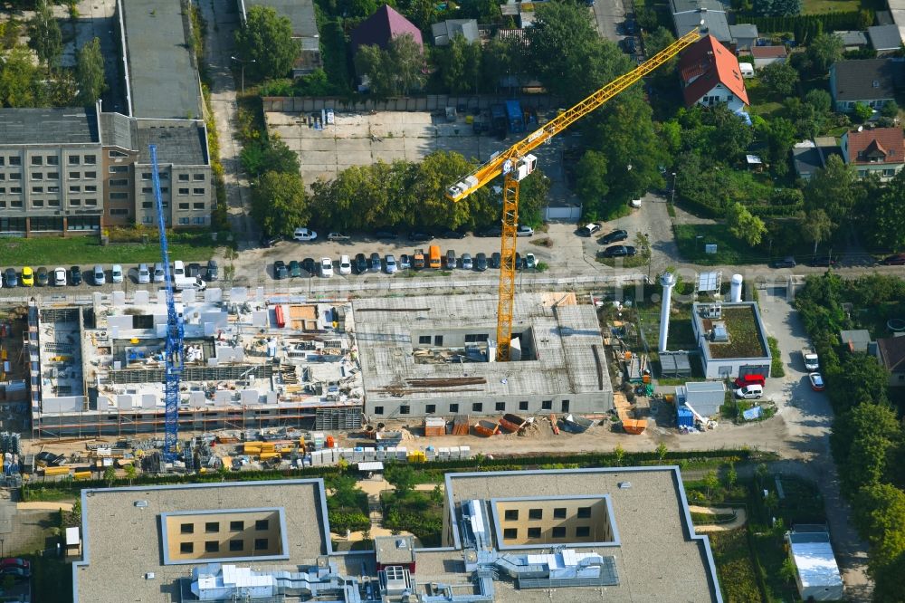 Berlin from above - Construction site of a new build retirement home of Vivantes Forum fuer Senioren GmbH on Muensterberger Weg in the district Kaulsdorf in Berlin, Germany