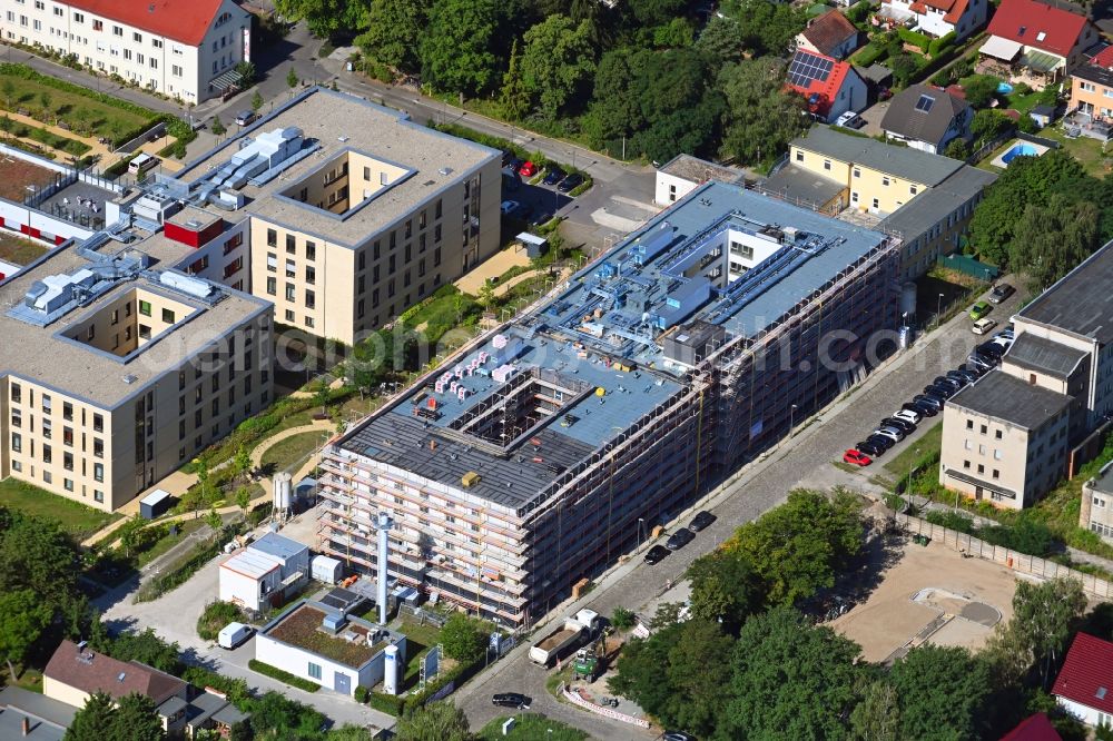 Berlin from above - Construction site of a new build retirement home of Vivantes Forum fuer Senioren GmbH on Muensterberger Weg in the district Kaulsdorf in Berlin, Germany