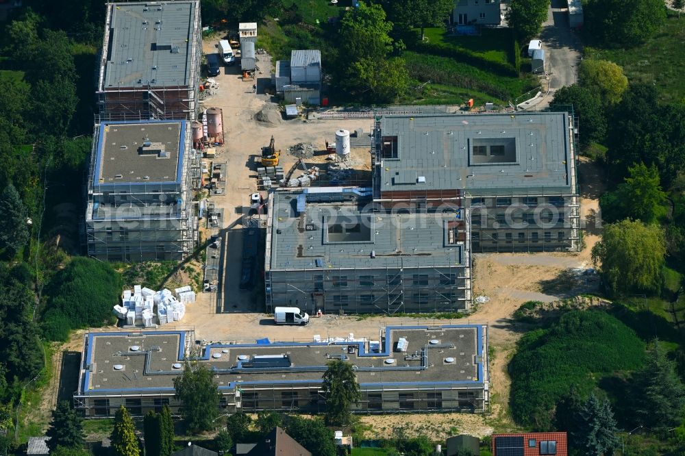 Aerial image Berlin - Construction site of a new build retirement home on Wernergraben corner Sudermannstrasse in the district Mahlsdorf in Berlin, Germany