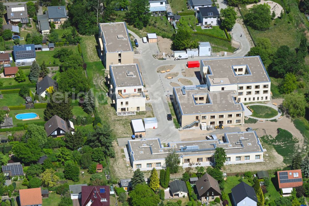 Aerial photograph Berlin - Construction site of a new build retirement home on Wernergraben corner Sudermannstrasse on street Florastrasse in the district Mahlsdorf in Berlin, Germany