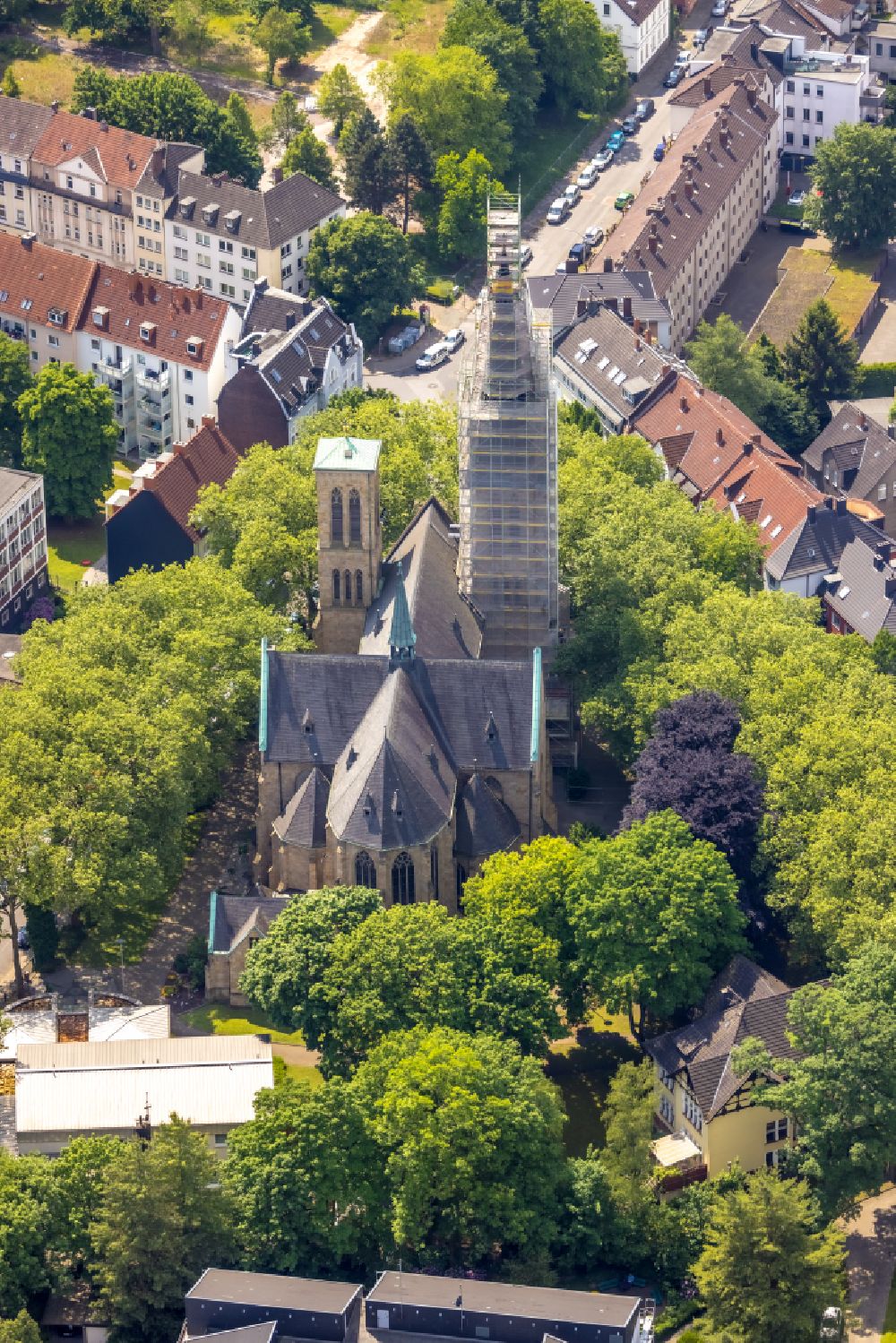 Herne from the bird's eye view: Construction site for renovation and reconstruction work on the church building Herz Jesu Kirche on street Duengelstrasse in Herne at Ruhrgebiet in the state North Rhine-Westphalia, Germany
