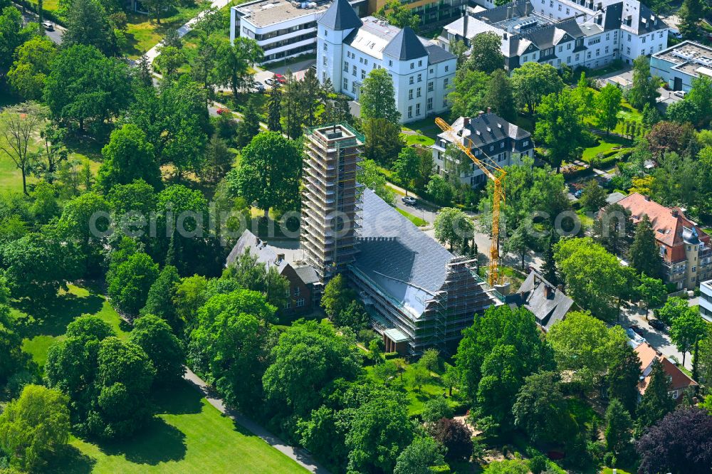 Aerial photograph Berlin - Construction site for renovation and reconstruction work on the church building Jesus-Christus-Kirche on street Hittorfstrasse in the district Dahlem in Berlin, Germany