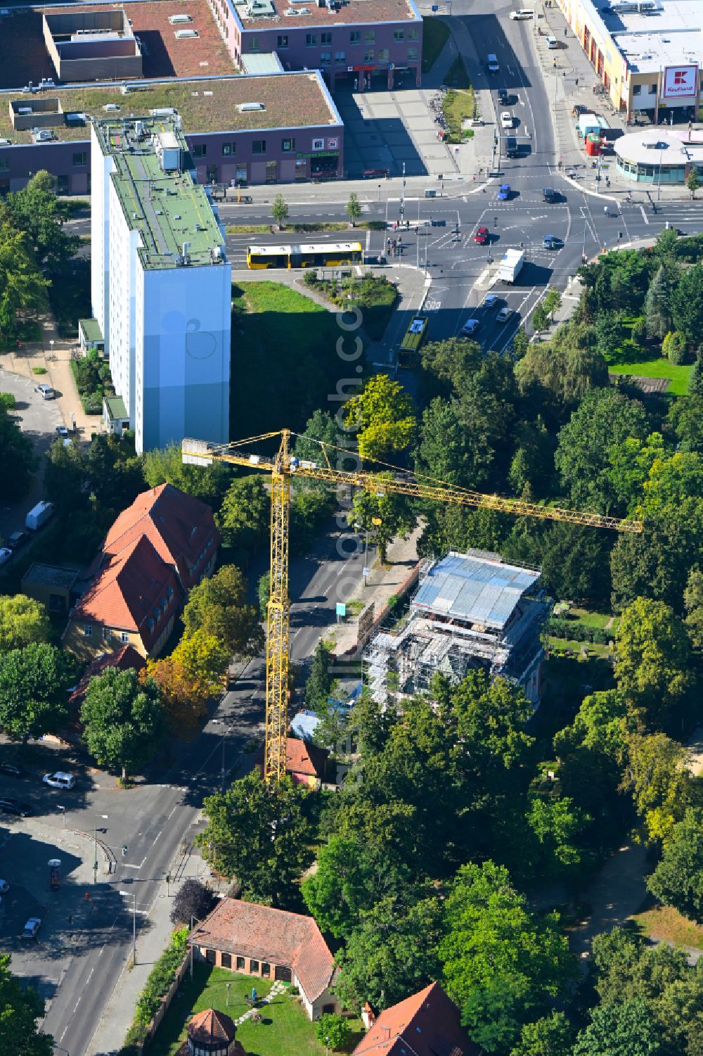 Aerial image Berlin - Construction site for renovation and reconstruction work on the church building of Schlosskirche on street Alt-Buch in the district Buch in Berlin, Germany