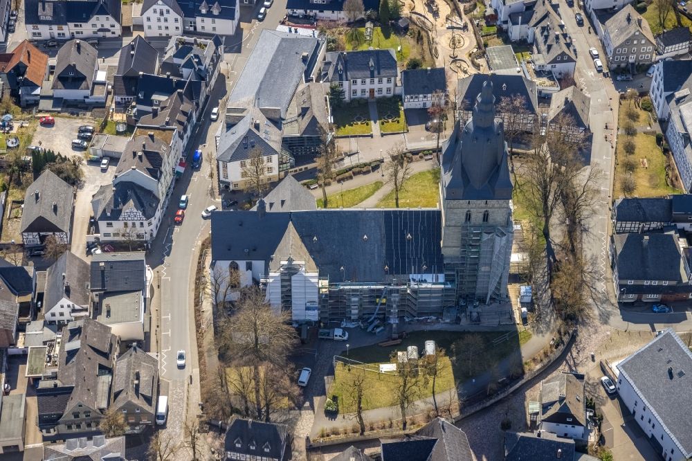 Brilon from the bird's eye view: Construction site for renovation and reconstruction work on the church building Propstei St. Petrus and Andreas in Brilon at Sauerland in the state North Rhine-Westphalia, Germany