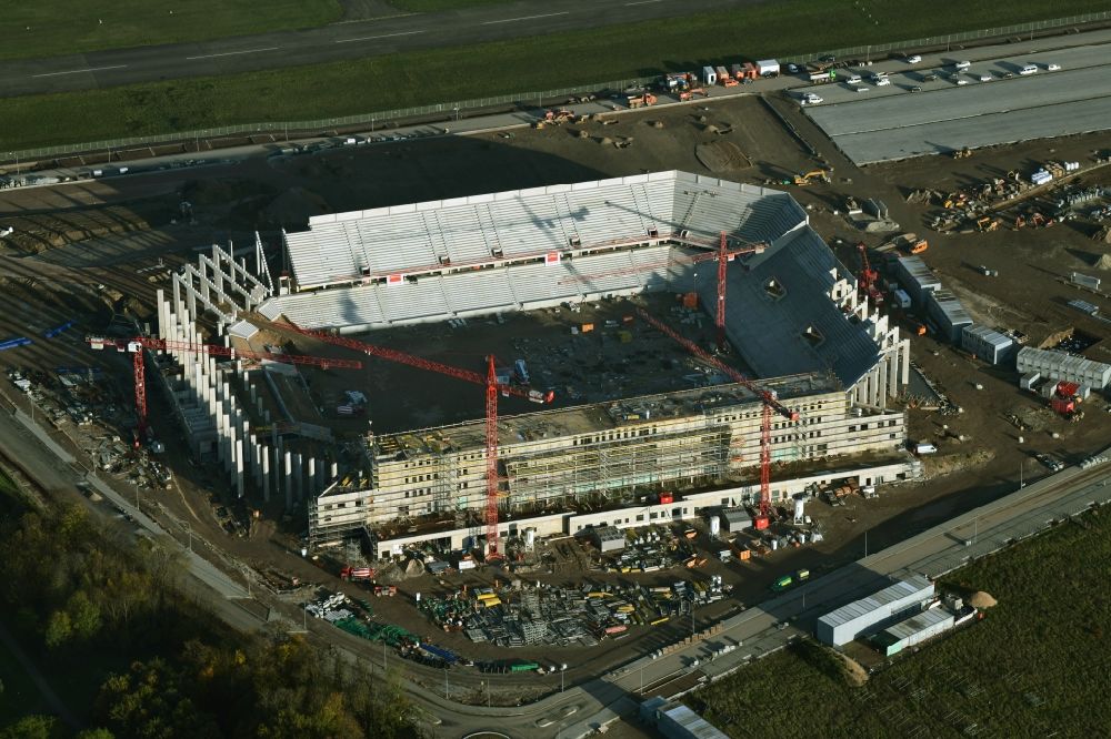 Freiburg im Breisgau from the bird's eye view: Construction site on the sports ground of the stadium SC-Stadion of Stadion Freiburg Objekttraeger GmbH & Co. KG (SFG) in the district Bruehl in Freiburg im Breisgau in the state Baden-Wuerttemberg, Germany. The new stadium is next to the airport EDTF