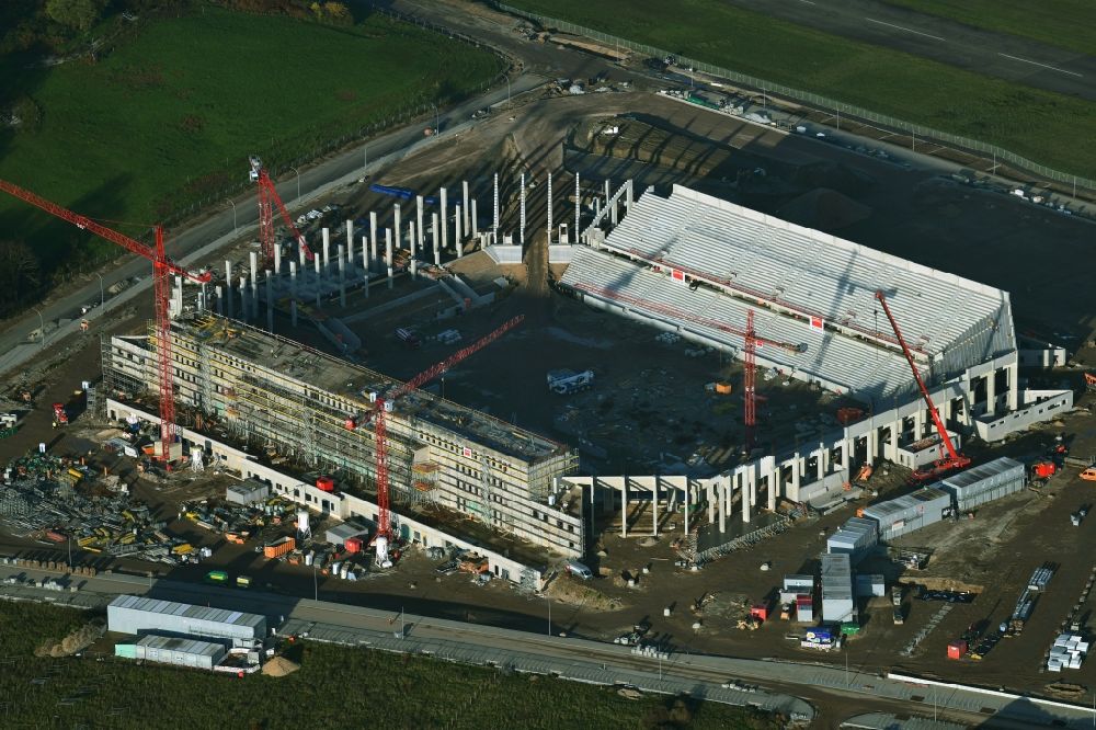 Freiburg im Breisgau from above - Construction site on the sports ground of the stadium SC-Stadion of Stadion Freiburg Objekttraeger GmbH & Co. KG (SFG) in the district Bruehl in Freiburg im Breisgau in the state Baden-Wuerttemberg, Germany. The new stadium is next to the airport EDTF