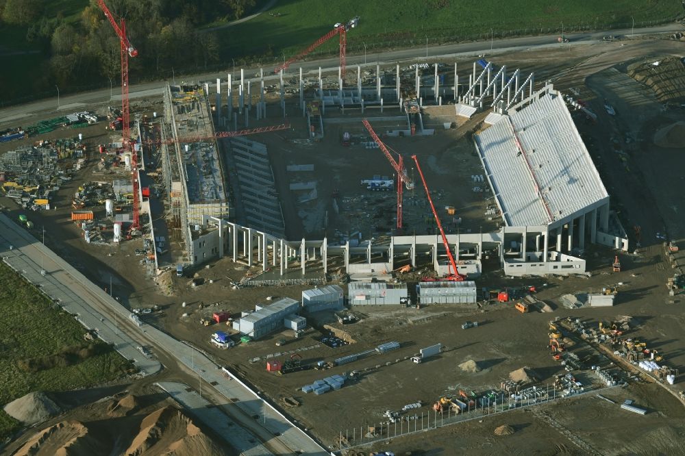 Freiburg im Breisgau from above - Construction site on the sports ground of the stadium SC-Stadion of Stadion Freiburg Objekttraeger GmbH & Co. KG (SFG) in the district Bruehl in Freiburg im Breisgau in the state Baden-Wuerttemberg, Germany. The new stadium is next to the airport EDTF