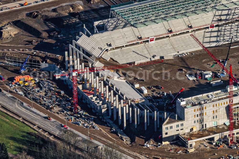 Freiburg im Breisgau from above - Construction site on the sports ground of the stadium SC-Stadion of Stadion Freiburg Objekttraeger GmbH & Co. KG (SFG) in the district Bruehl in Freiburg im Breisgau in the state Baden-Wurttemberg, Germany. The new stadium is next to the airport EDTF