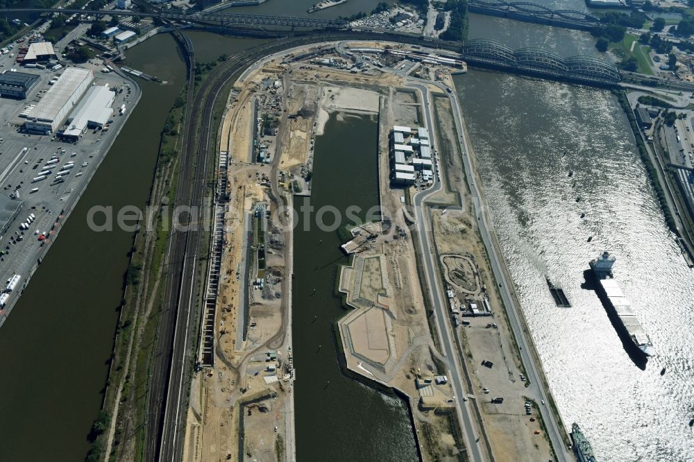 Hamburg from above - Construction site of the city development area Baakenhafen on the Elbe in Hamburg. Since the resolution of the Senate in 1998, the harbor and the surrounding headlands are formally part of the project HafenCity, where the port areas released south of the city center of Hamburg from its original use and to be converted to retail, commercial, residential and leisure-related areas