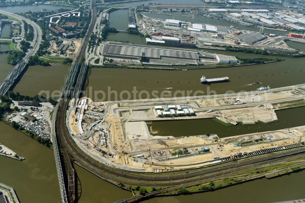 Aerial photograph Hamburg - Construction site of the city development area Baakenhafen on the Elbe in Hamburg. Since the resolution of the Senate in 1998, the harbor and the surrounding headlands are formally part of the project HafenCity, where the port areas released south of the city center of Hamburg from its original use and to be converted to retail, commercial, residential and leisure-related areas