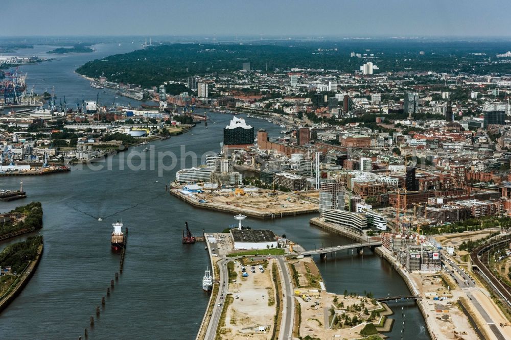 Hamburg from the bird's eye view: Construction site of the city development area Baakenhafen on the Elbe in Hamburg. Since the resolution of the Senate in 1998, the harbor and the surrounding headlands are formally part of the project HafenCity, where the port areas released south of the city center of Hamburg from its original use and to be converted to retail, commercial, residential and leisure-related areas