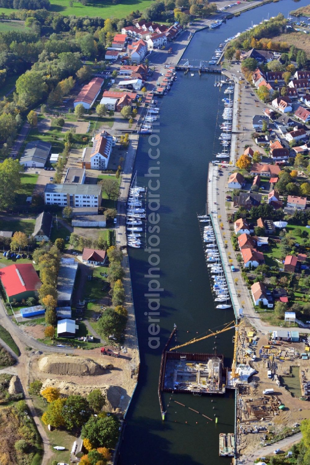 Aerial photograph Greifswald - View at the construction site of the storm surge barrier in the Ryck at the Bodden in the district Wieck in Greifswald in the federal state Mecklenburg-Vorpommern. The surge barrier Greifswald-Wieck forms an integral part of the flood protection system for Greifswald. Responsible for the planning is the Hydro Project Engineer GmbH operating construction company is the Ed. Züblin AG