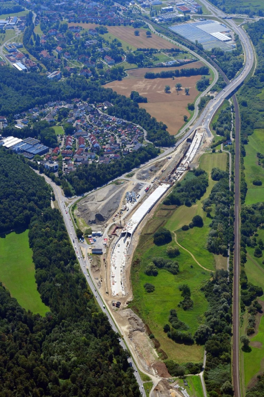 Reichenau from the bird's eye view: Construction site with tunnel guide of Waldsiedlungstunnel for the route of B33 near Constance in Reichenau in the state Baden-Wuerttemberg, Germany