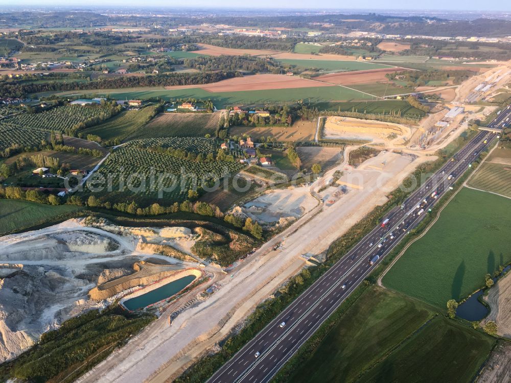 Aerial image Rivoltella - Construction site with tunnel guide for the route of fast railway parallel to the A4 in Rivoltella in the Lombardy, Italy