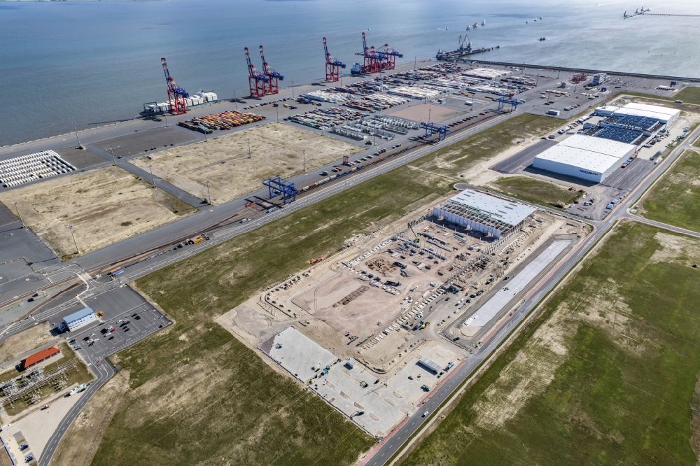 Wilhelmshaven from the bird's eye view: View of the construction site of the new packaging center for car parts VW Audi Jade Weser Port (JWP) on the North Sea coast in Wilhelmshaven in the state of Lower Saxony