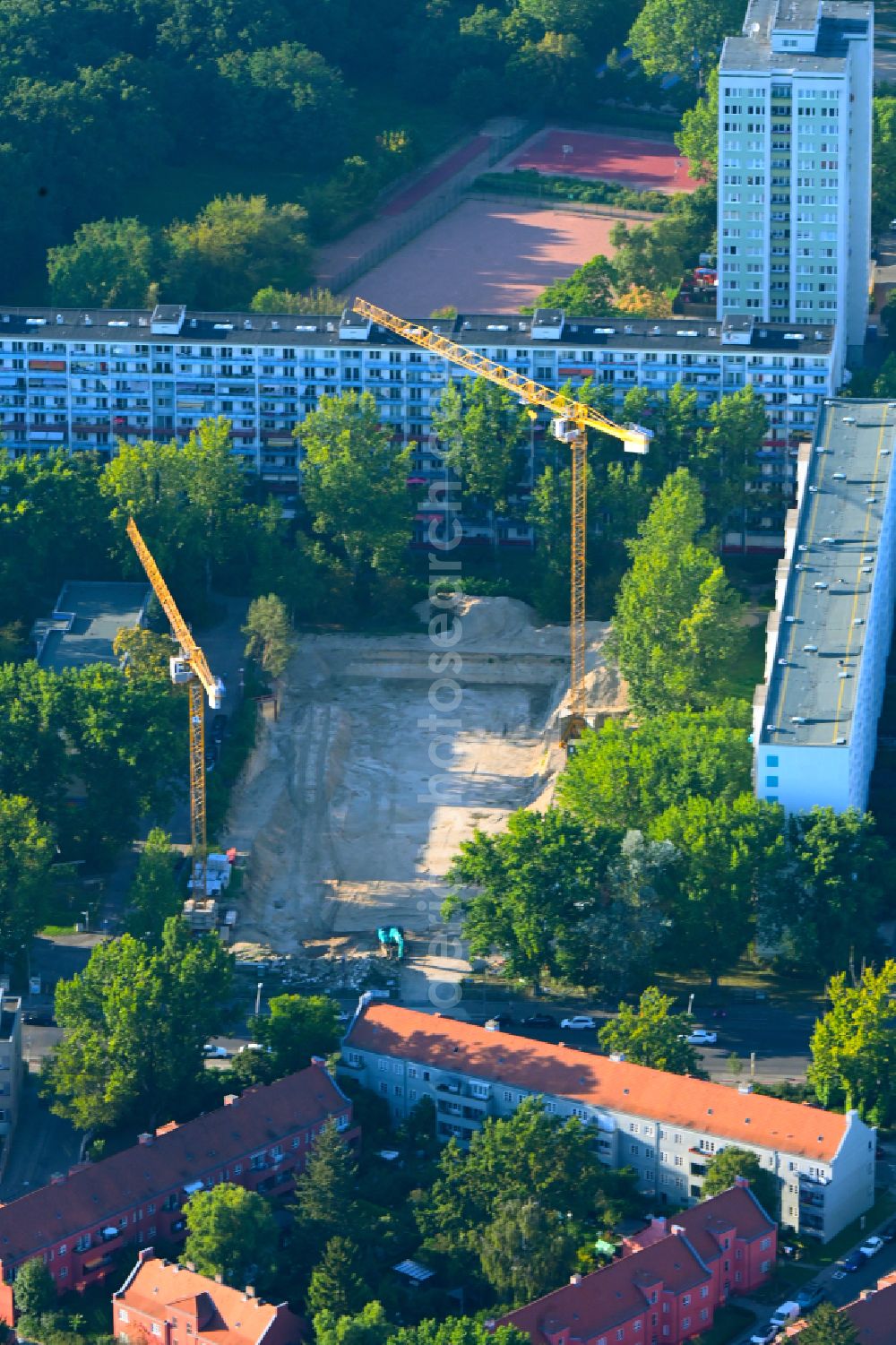 Berlin from the bird's eye view: Construction site for the new construction of the building complex of a residential complex with an integrated local supply center ALDI - Nord on street Sewanstrasse in the district Friedrichsfelde in Berlin, Germany