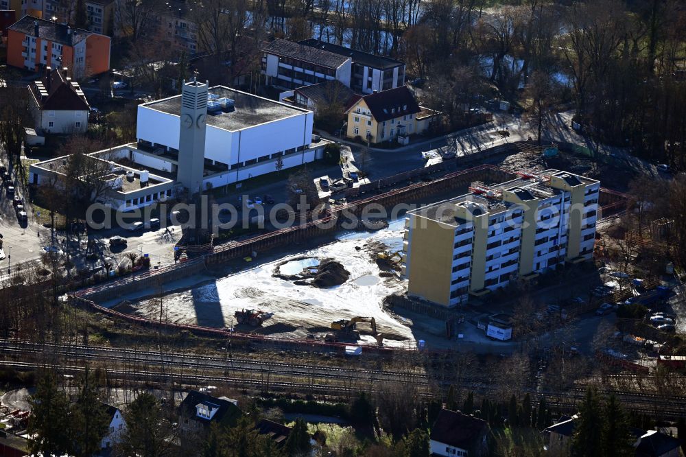 Aerial photograph Puchheim - Construction site for the new construction of the building complex of a residential complex with an integrated local supply center on street Alois-Harbeck-Platz - Allinger Strasse in Puchheim in the state Bavaria, Germany