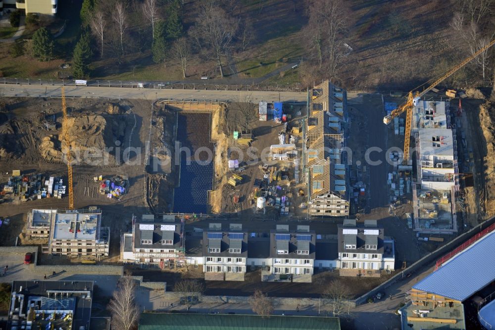 Aerial photograph Berlin - Construction site of the residential compound Leonorengaerten in the Lankwitz part of the district of Steglitz-Zehlendorf in Berlin. The site is located on Leonoren Street and will consist of semi-detached houses and single family units. The project is run by Interhomes AG. The sports facilities Leonorenstrasse and the ice rink Lankwitz are in close vicinity of the site