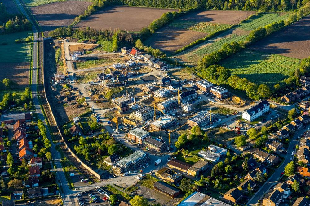 Münster from above - Residential construction site with multi-family housing development- on the Petersdamm - Petersheide - Hoffmannweg in the district Wolbeck in Muenster in the state North Rhine-Westphalia, Germany