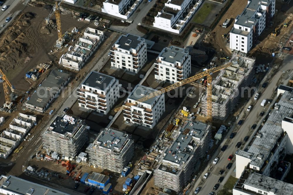 Aerial image Berlin - Construction site and residential area Steglitzer ParkQuartier in the Lichterfelde part of the district of Steglitz-Zehlendorf in Berlin. New multi-family homes and estates are being developed on the site of the Square of the US-Berlin-Brigades which is surrounded by woods, green areas and playgrounds. It is developed by the Swedish Construction and Real Estate Company NCC AB