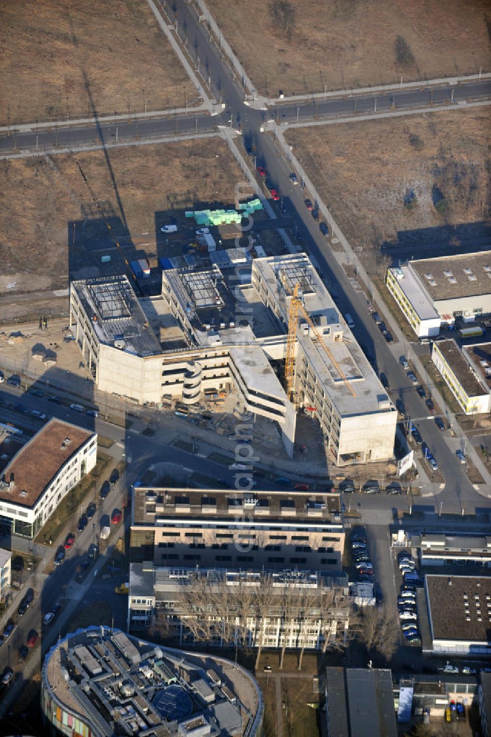 Aerial image Berlin - Construction site of the Centre for Photovoltaic in the Technology Park in Berlin Adlershof. The construction of the hall, laboratory and office building will be conducted by WISTA-Management GmbH in cooperation with Henn Architekten. The Science and Technology Park Adlershof is a cluster of technology centers and research instituts