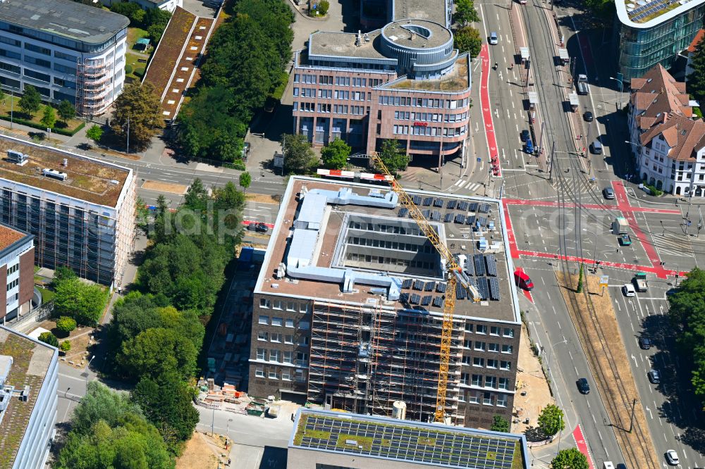 Freiburg im Breisgau from the bird's eye view: Construction site for the construction of a new office and commercial building ensemble Businessmile on Heinrich-von-Stephan-Strasse in the district Wiehre in Freiburg im Breisgau in the state Baden-Wuerttemberg, Germany