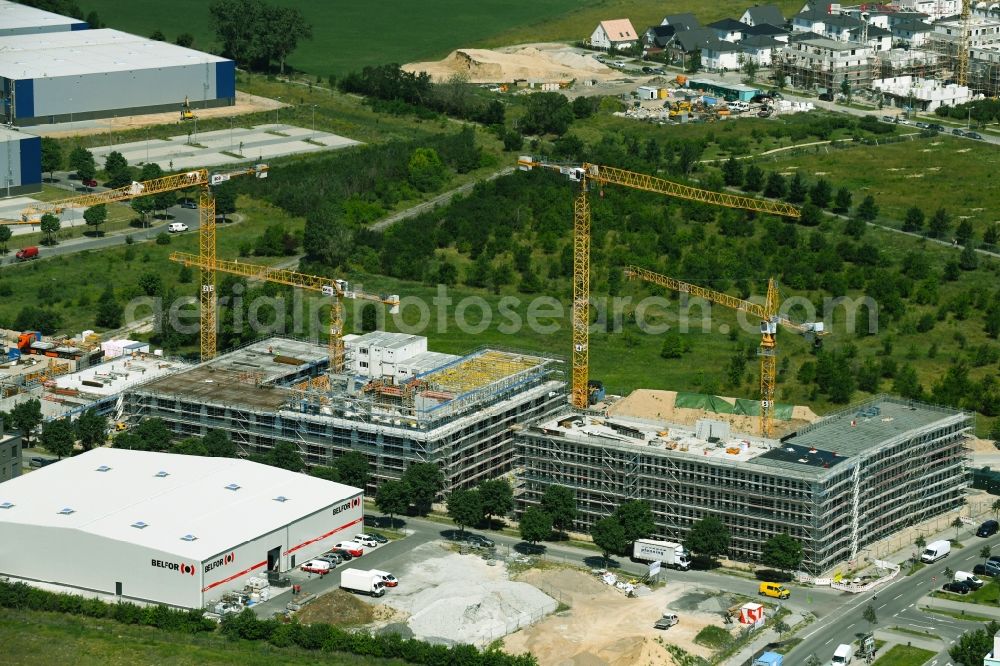 Aerial photograph Schönefeld - Construction site for the new building of an office building - ensemble on Mizarstrasse in Schoenefeld in the state Brandenburg, Germany