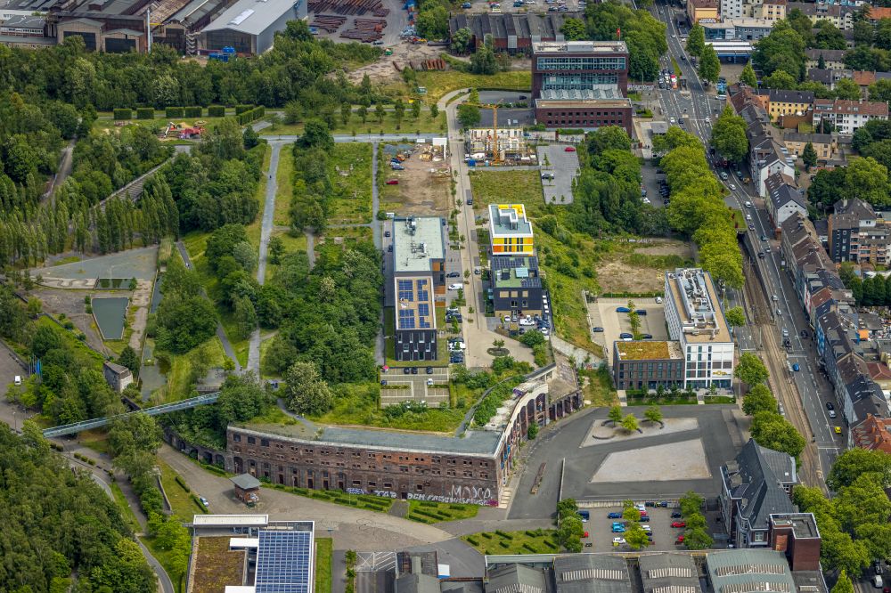 Aerial image Bochum - Construction site to build a new office and commercial building Kultur Ruhr GmbH in the West Park in Bochum at Ruhrgebiet in the state North Rhine-Westphalia. Nearby the ruin of the former entrance of the Krupp grounds