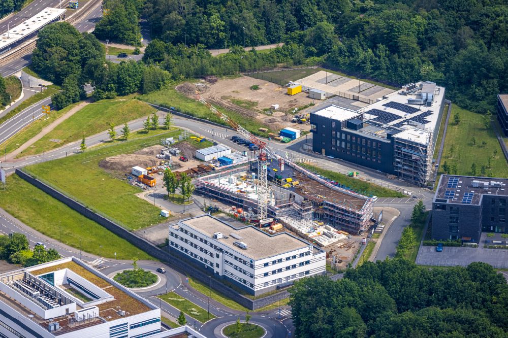Aerial photograph Bochum - Construction site for the new building of an Office building - Ensemble Buerohauses of Firma Cosinex on street Gesundheitscampus-Sued in the district Querenburg in Bochum at Ruhrgebiet in the state North Rhine-Westphalia, Germany