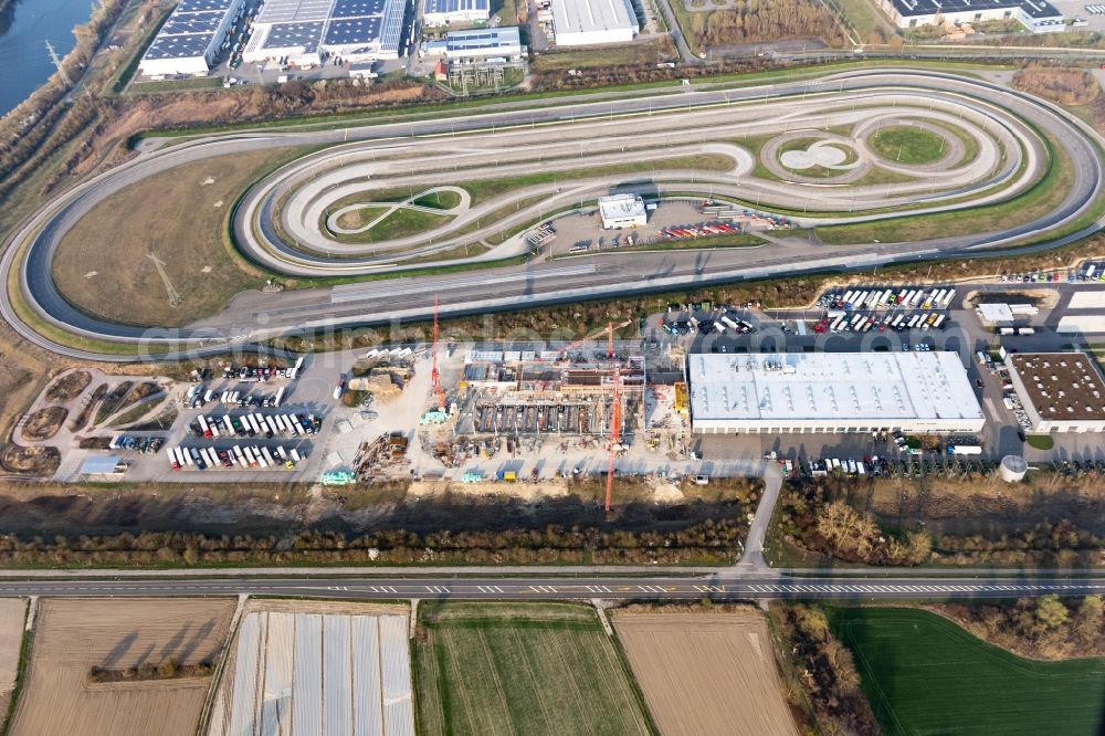 Aerial photograph Wörth am Rhein - Construction site for the new building and Erweiterung of and expansion of the truck development and testing center in the district Industriegebiet Woerth-Oberwald in Woerth am Rhein in the state Rhineland-Palatinate, Germany