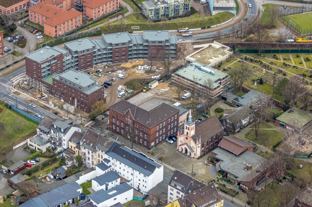 Aerial photograph Oberhausen - Construction site for the new building on Eugen-Zur-Nieden-Ring - Steinbrinkstrasse overlooking the Friedenskirche in the district Sterkrade-Nord in Oberhausen at Ruhrgebiet in the state North Rhine-Westphalia, Germany