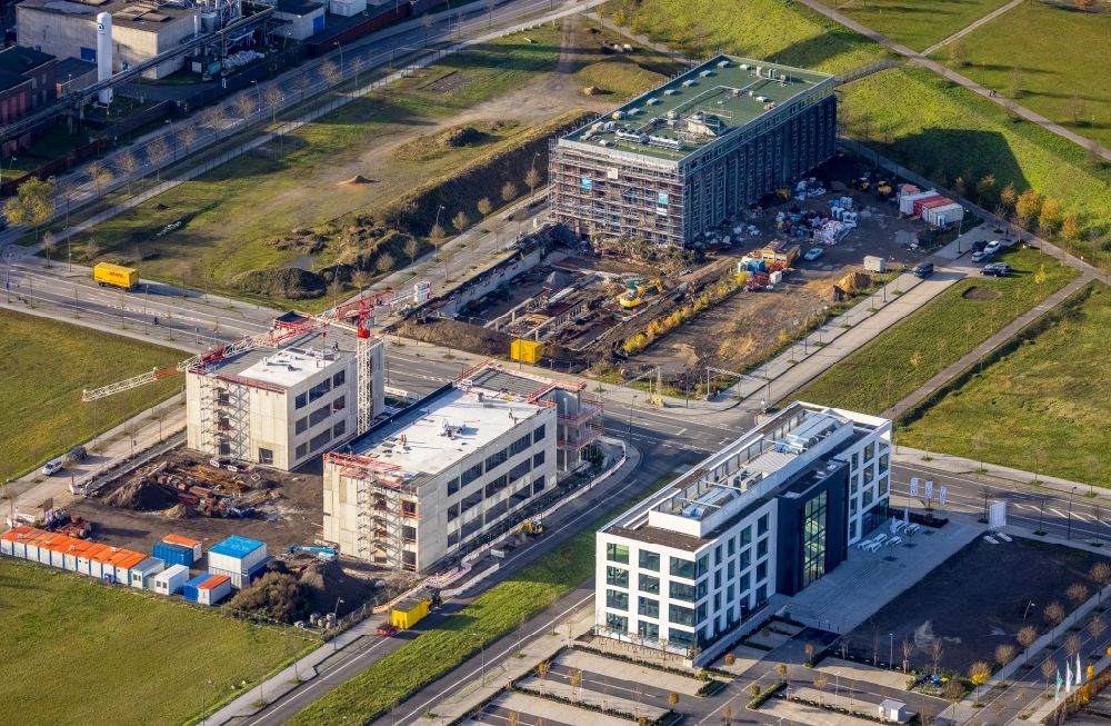 Aerial photograph Dortmund - Construction site for the new building of a research building and office complex of DAIKIN Chemical Europe GmbH overlooking the Phoenix-Arcaden and the TMM Forum on Carlo-Schmid-Allee - Walter-Bruch-Strasse - Antonio-Segni-Strasse in the district Phoenix-West in Dortmund in the state North Rhine-Westphalia, Germany