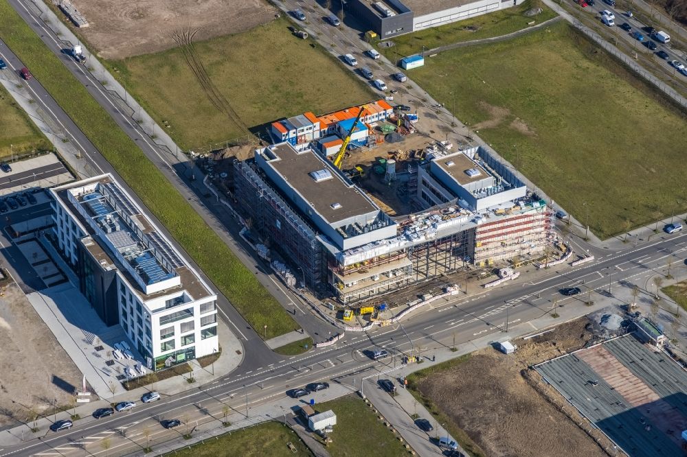 Aerial photograph Dortmund - Construction site for the new building of a research building and office complex of DAIKIN Chemical Europe GmbH overlooking the TMM Forum on Carlo-Schmid-Allee - Walter-Bruch-Strasse - Antonio-Segni-Strasse in the district Phoenix-West in Dortmund in the state North Rhine-Westphalia, Germany
