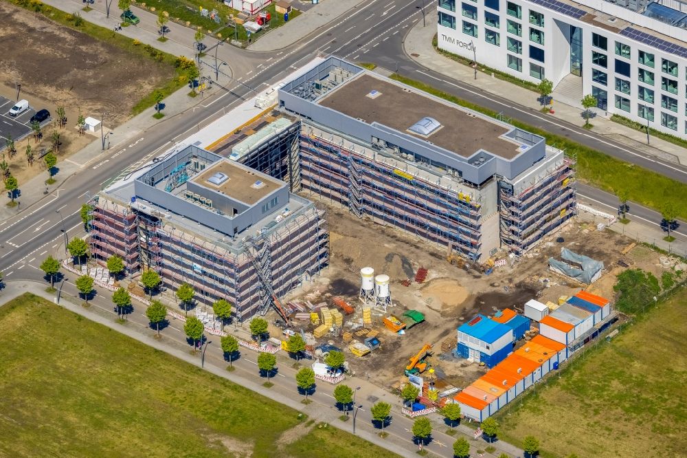 Aerial image Dortmund - Construction site for the new building of a research building and office complex of DAIKIN Chemical Europe GmbH overlooking the TMM Forum on Carlo-Schmid-Allee - Walter-Bruch-Strasse - Antonio-Segni-Strasse in the district Phoenix-West in Dortmund in the state North Rhine-Westphalia, Germany