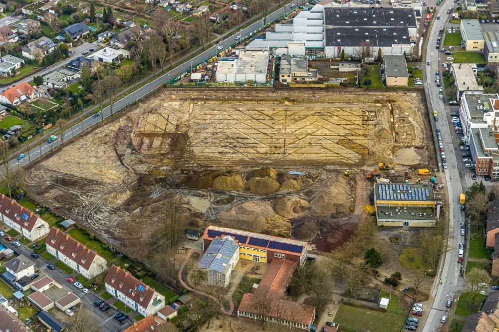 Gladbeck from the bird's eye view: Construction site for new construction building of the construction market on the grounds of the formerly sports ground between Konrad-Adenauer-Allee and Krusenkamp in Gladbeck in the state North Rhine-Westphalia, Germany