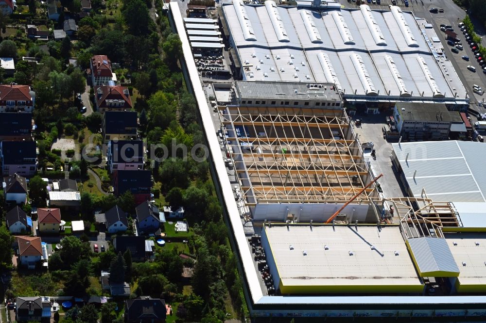 Berlin from the bird's eye view: Construction site for new construction building of the construction market on Landsberger Strasse in the district Mahlsdorf in Berlin, Germany