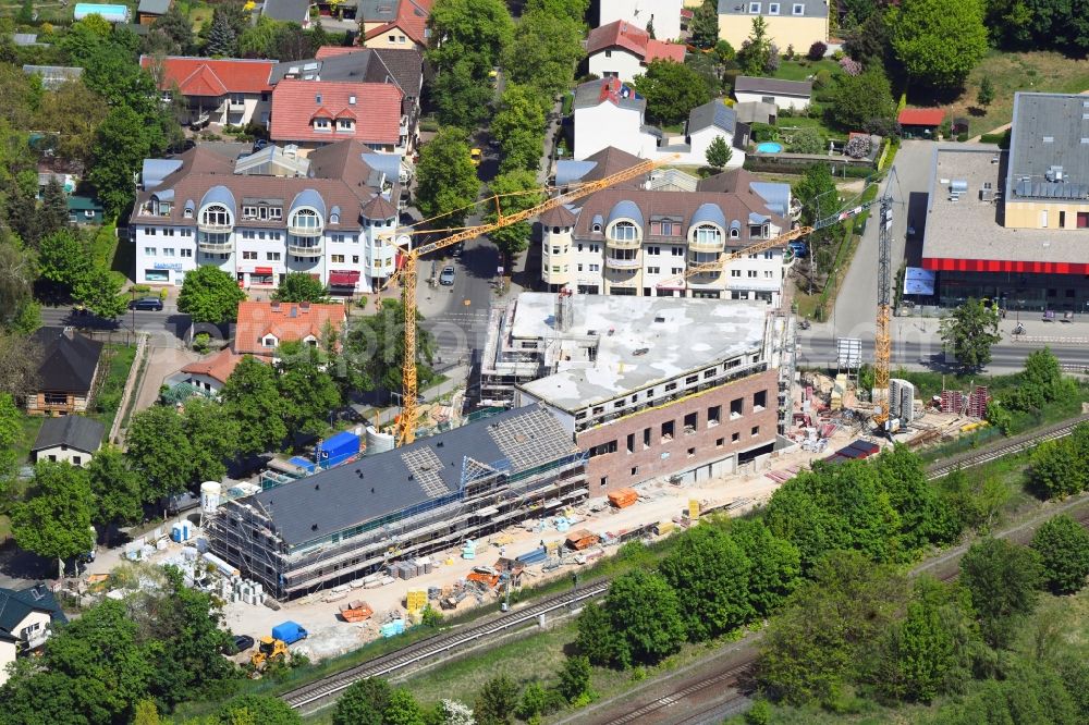 Aerial image Neuenhagen - New construction of the building complex of the shopping center on Eisenbahnstrasse in Neuenhagen in the state Brandenburg, Germany
