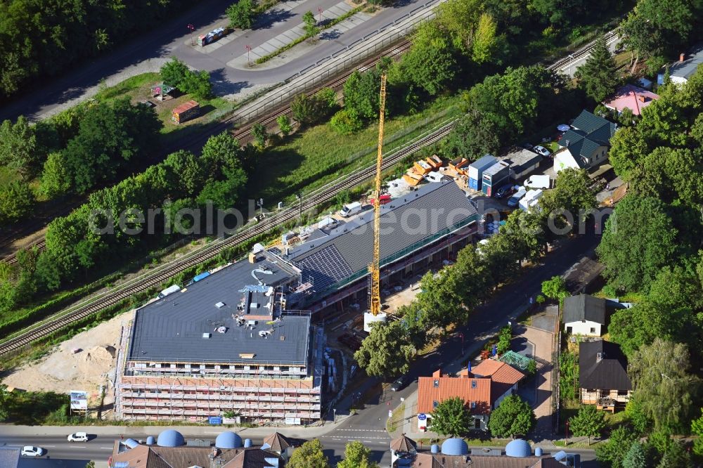 Aerial photograph Neuenhagen - New construction of the building complex of the shopping center on Eisenbahnstrasse in Neuenhagen in the state Brandenburg, Germany