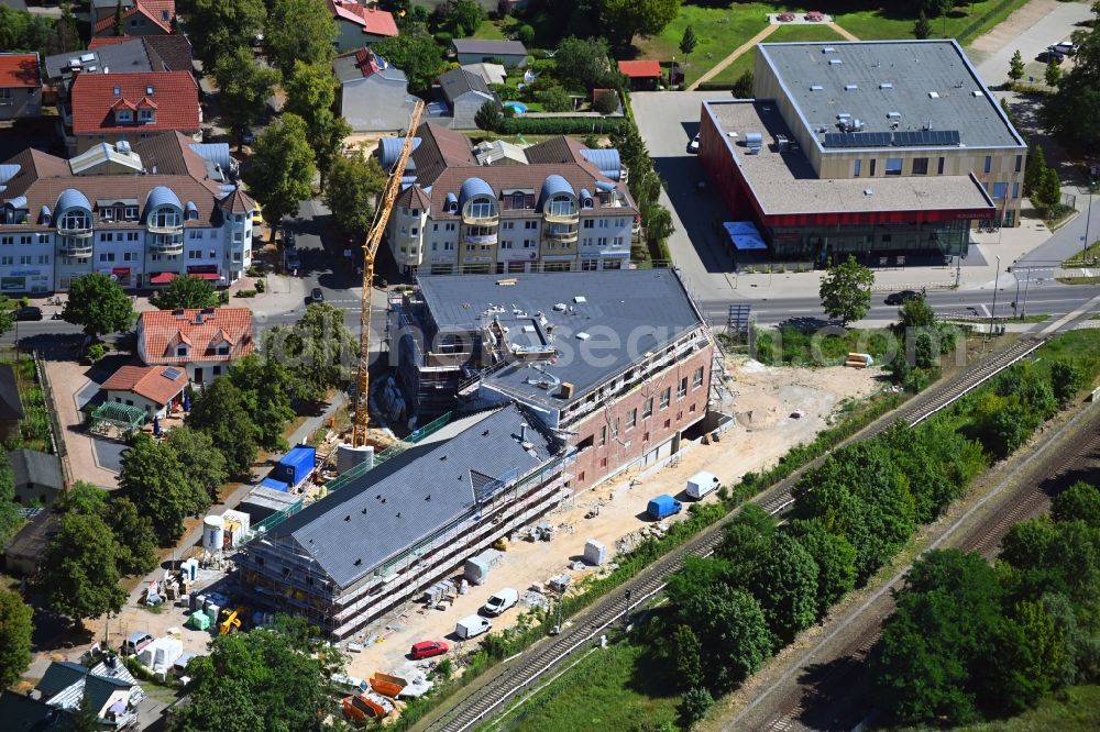 Aerial photograph Neuenhagen - New construction of the building complex of the shopping center on Eisenbahnstrasse in Neuenhagen in the state Brandenburg, Germany