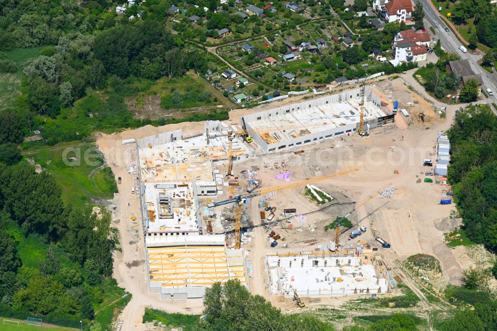 Hansestadt Wismar from above - New construction of the building complex of the shopping center on street Schweriner Strasse in Hansestadt Wismar at the baltic sea coast in the state Mecklenburg - Western Pomerania, Germany
