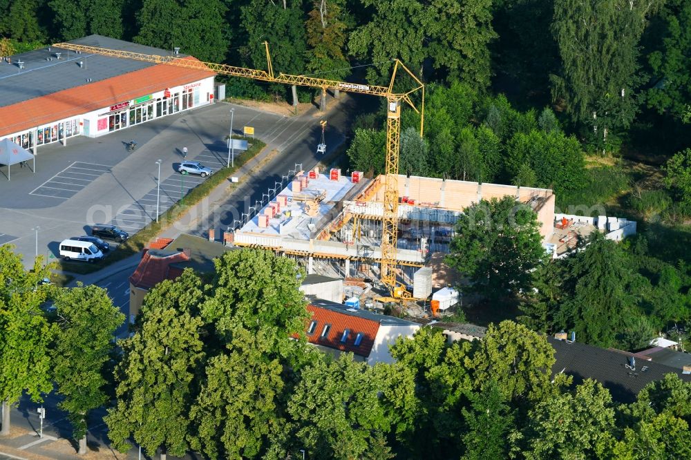Aerial photograph Werneuchen - New construction of the building complex of the shopping center einer Rossmann-Filiale on Schulstrasse in Werneuchen in the state Brandenburg, Germany