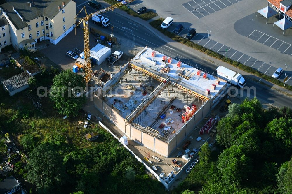 Aerial photograph Werneuchen - New construction of the building complex of the shopping center einer Rossmann-Filiale on Schulstrasse in Werneuchen in the state Brandenburg, Germany