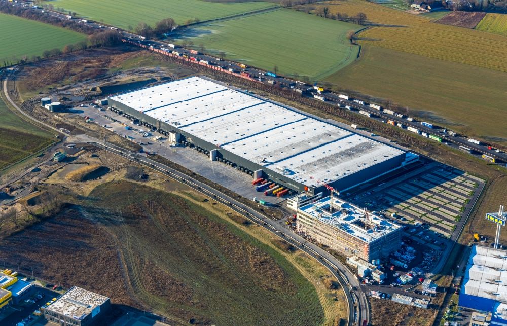Unna from the bird's eye view: Construction site to build a new building complex on the site of the logistics center of Woolworth GmbH in the district Alte Colonie in Kamen in the state North Rhine-Westphalia, Germany