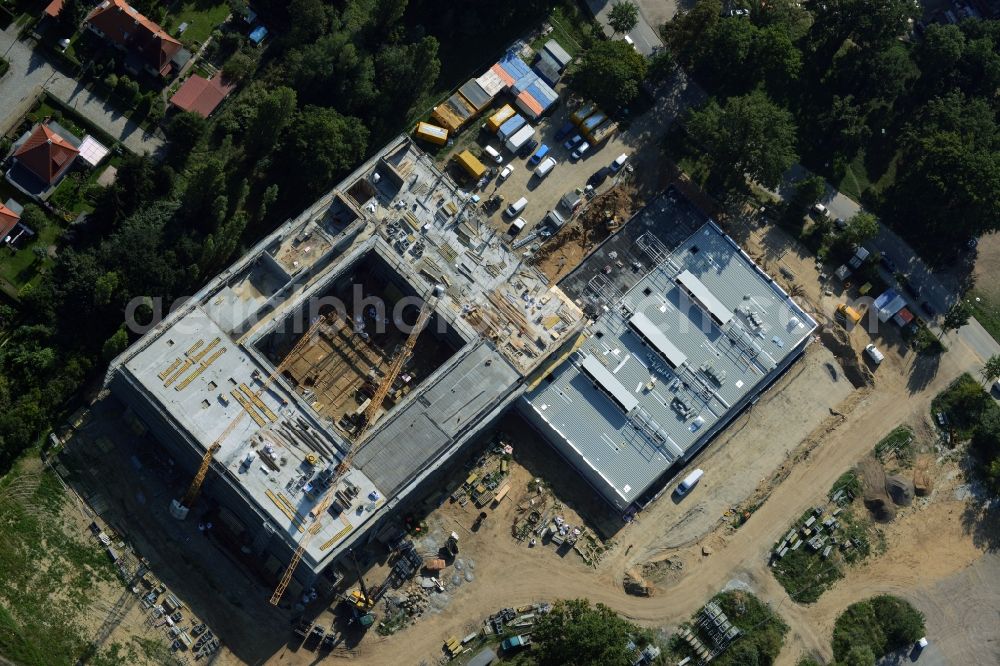 Potsdam from the bird's eye view: Construction site for the new building of Leonardo-Da-Vinci school on Esplanade street in Potsdam in the state of Brandenburg. The school is being built on Bornstedter Feld on site of the former federal garden show BUGA and opposite the Biospaehre Potsdam area