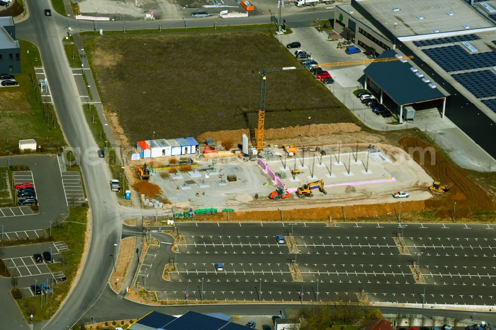 Aerial image Estenfeld - Construction site for the new building in the industrial estate on A7 on Sieboldstrasse in Estenfeld in the state Bavaria, Germany