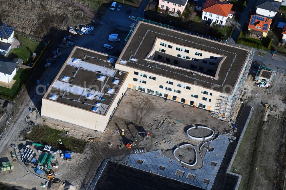 Berlin from above - Construction site of a primary school on Habichtshorst in the Biesdorf part of the district of Marzahn-Hellersdorf in Berlin. The premises will include a sports arena and a schoolyard and was developed by the architectural company ReimarHerbst