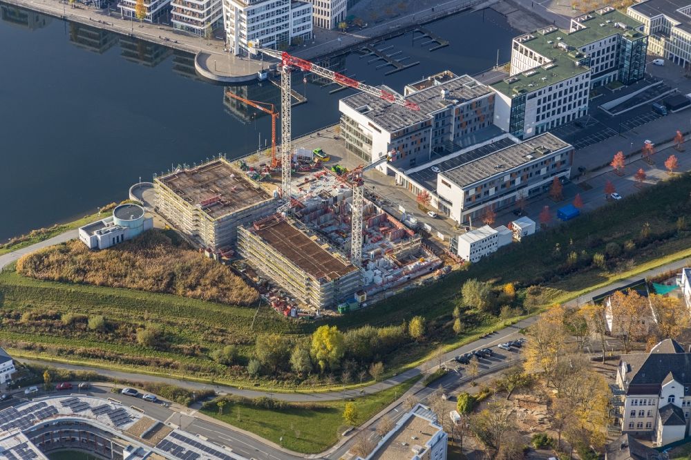 Aerial photograph Dortmund - Construction site for new high-rise building complex Comunita Residenz am Phoenix See An den Emscherauen - Hafenpromenade in the district Hoerde in Dortmund in the state North Rhine-Westphalia, Germany